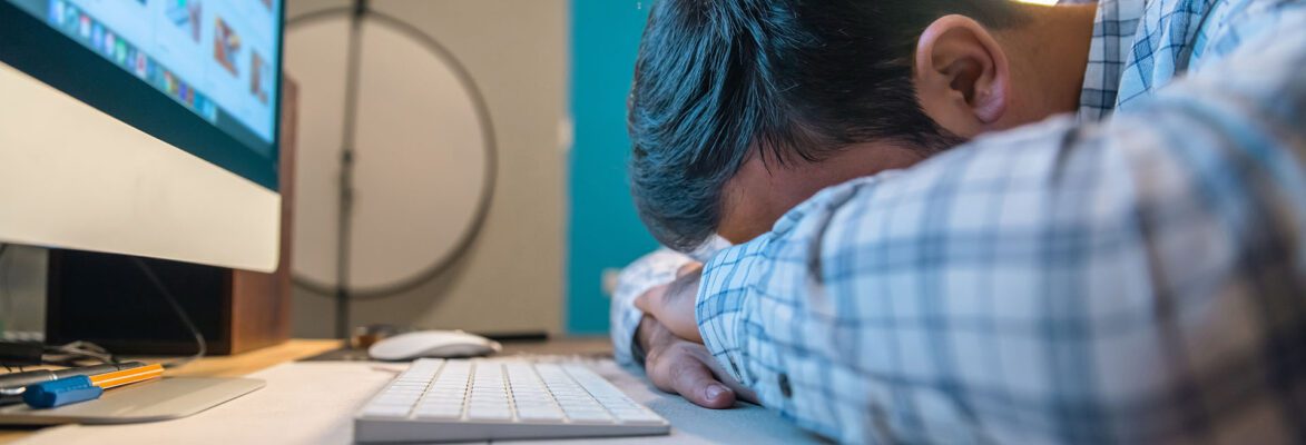 Sad tired man in office desk